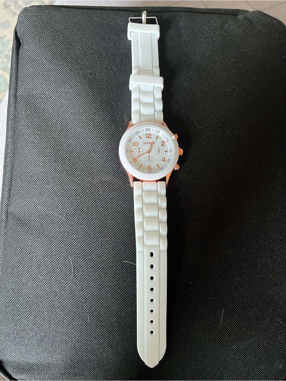 White watch with rose gold accents.